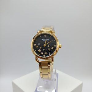 Reloj de pulsera de cuarzo de tono dorado para mujer con una esfera negra adornada con estrellas y gemas.