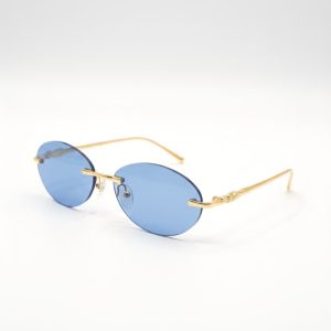 Gafas de sol ovaladas sin montura con lentes azules y montura de metal dorado.